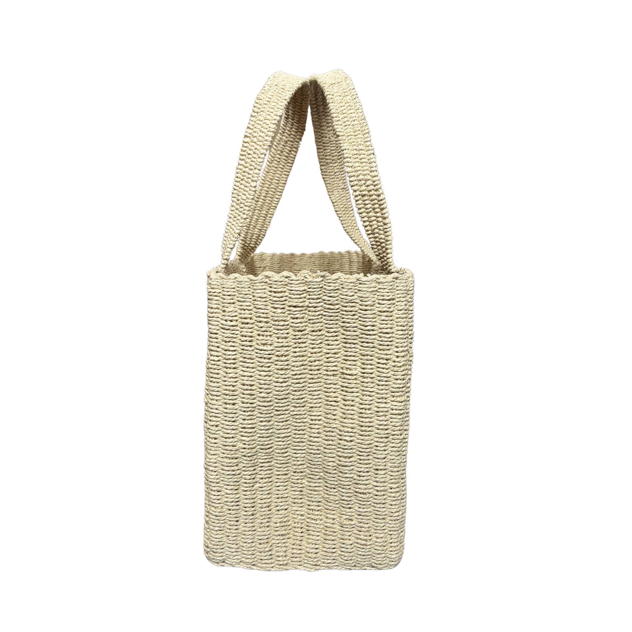 Natural Raffia Woven basket with handle on a white background