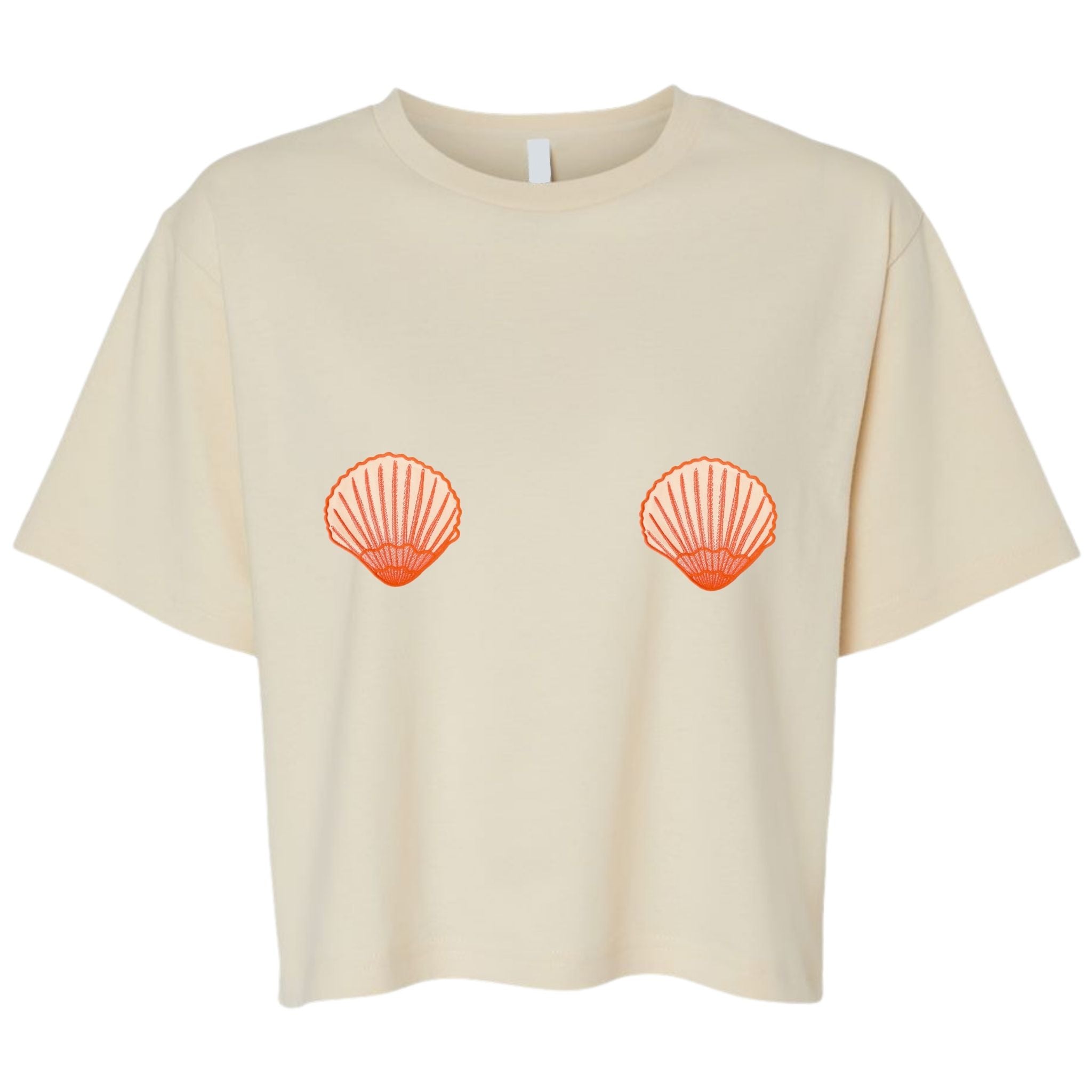 Je Swim Cream colored cropped t-shirt with two orange seashell graphics positioned on the chest area, displayed on a clean white background.