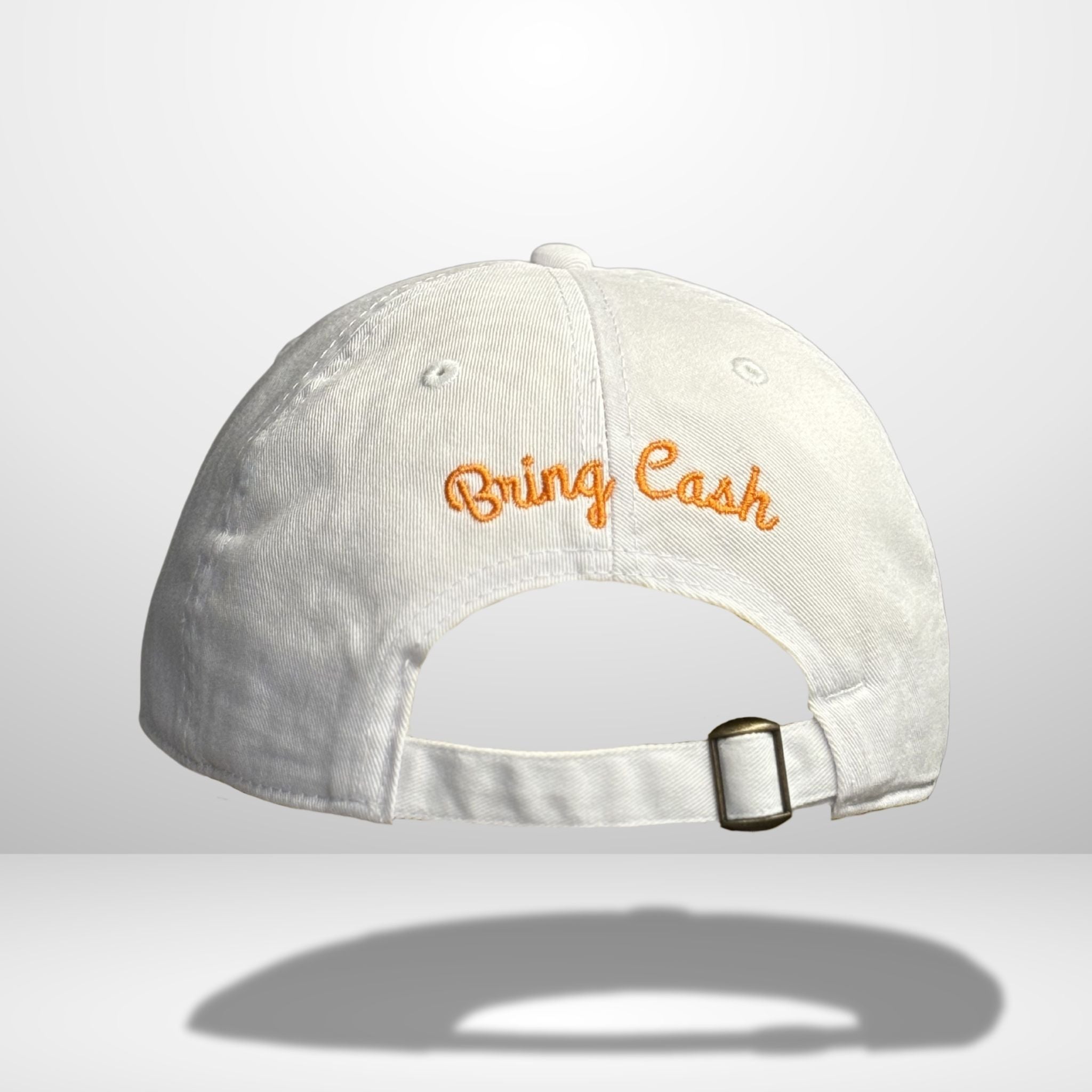 Back view of white cotton baseball cap showing orange embroidered 'Bring Cash' script text across the back panel with adjustable strap closure and metal hardware, photographed against clean white background.