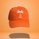 Orange baseball cap with the JE Swim logo and a white palm tree icon embroidered on the front.