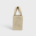 Natural woven tote bag, angled side view with open top.