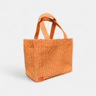 Orange woven tote bag, front view with tall shoulder straps.