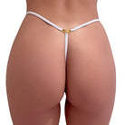 White g-string thong with a gold palm tree charm on a white background