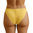 Yellow high-waisted Cheek Peek Bikini Bottom on a white background
