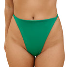 front view of a green g-string bikini bottom on a white background