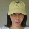 woman wearing the butter yellow "bored" cap